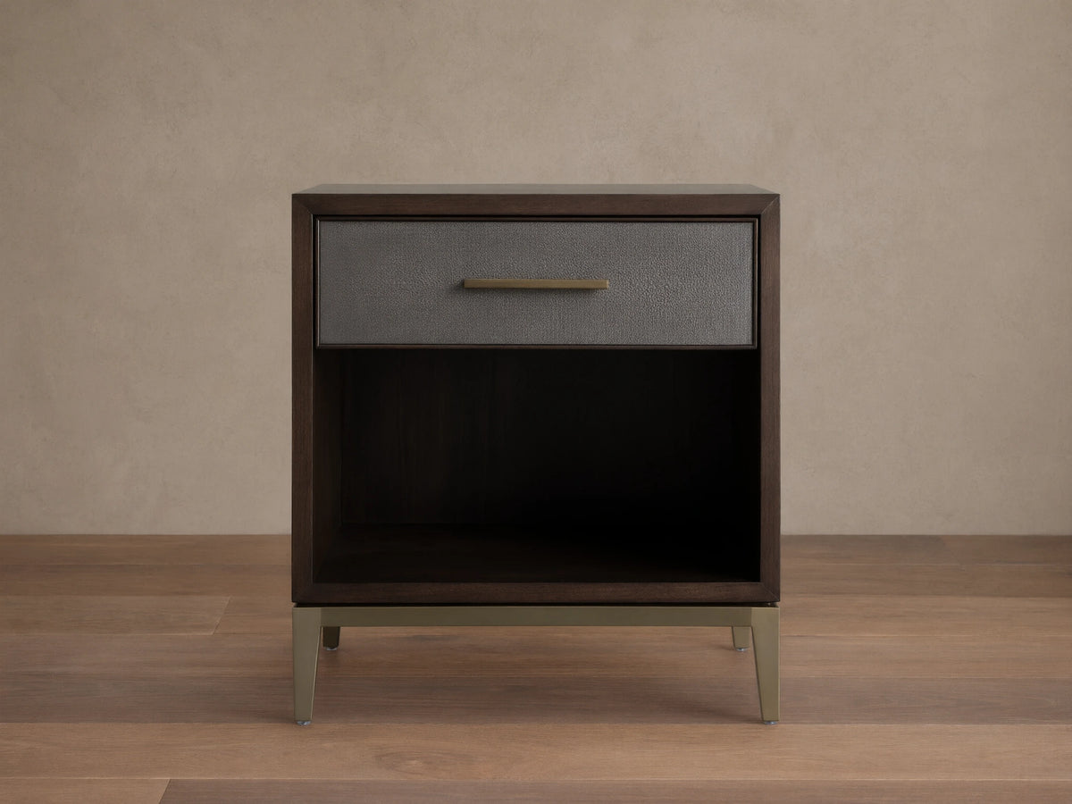 Malone Open Nightstand with dark wood finish, single drawer with reconstituted leather inset, metallic handle, open lower shelf, and metallic legs.
