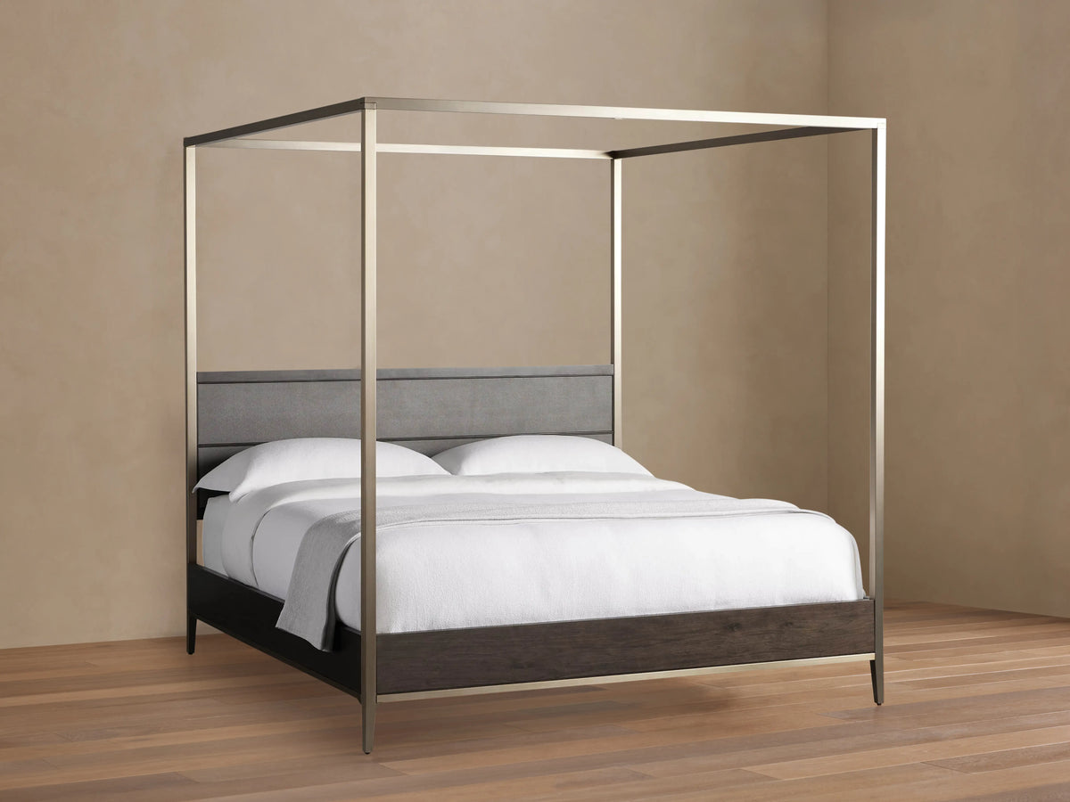 Malone Canopy Bed: Dark espresso wood frame, gray shagreen headboard, metallic champagne canopy. White bedding, light gray throw.