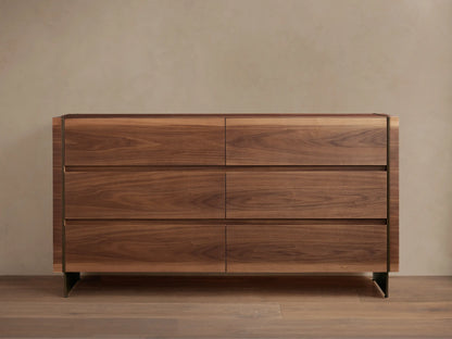 Mihaela Six-Drawer Dresser. Dark walnut veneer with six drawers, subtle metallic trim, on a wood floor.
