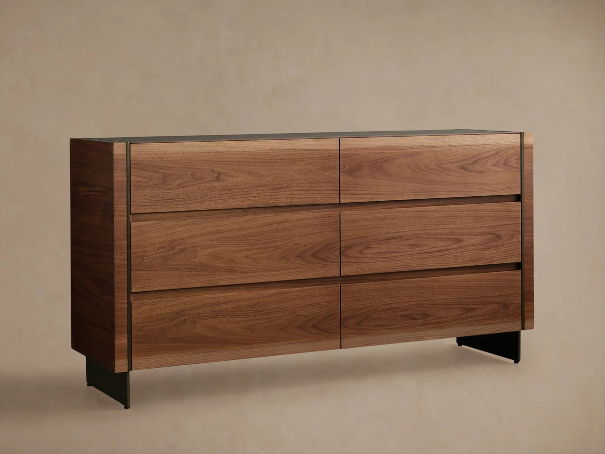 Mihaela Six-Drawer Dresser. Dark walnut veneer with six drawers, subtle metallic trim, on a wood floor.