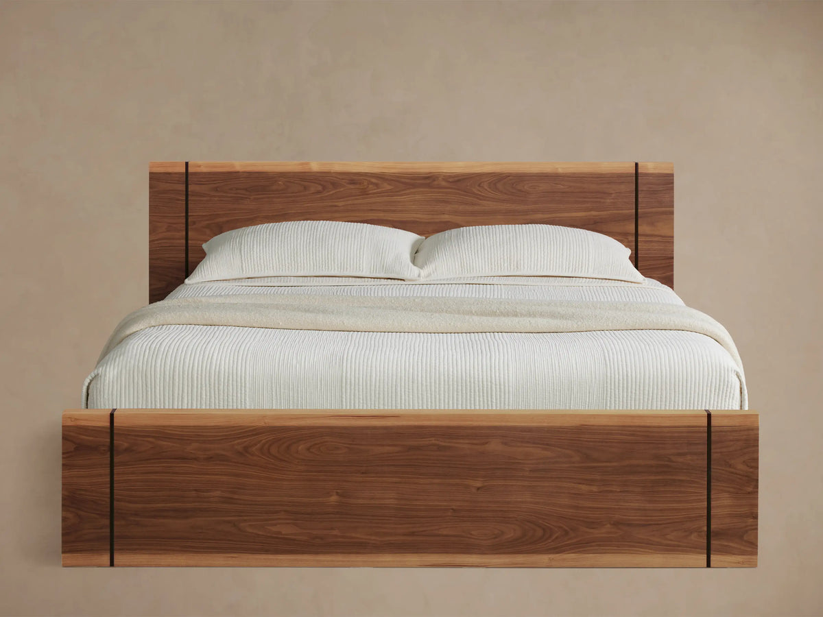 Mihaela Bed made of dark walnut wood with solid headboard and footboard, light wood accents, vertical dark inlays, white bedding.