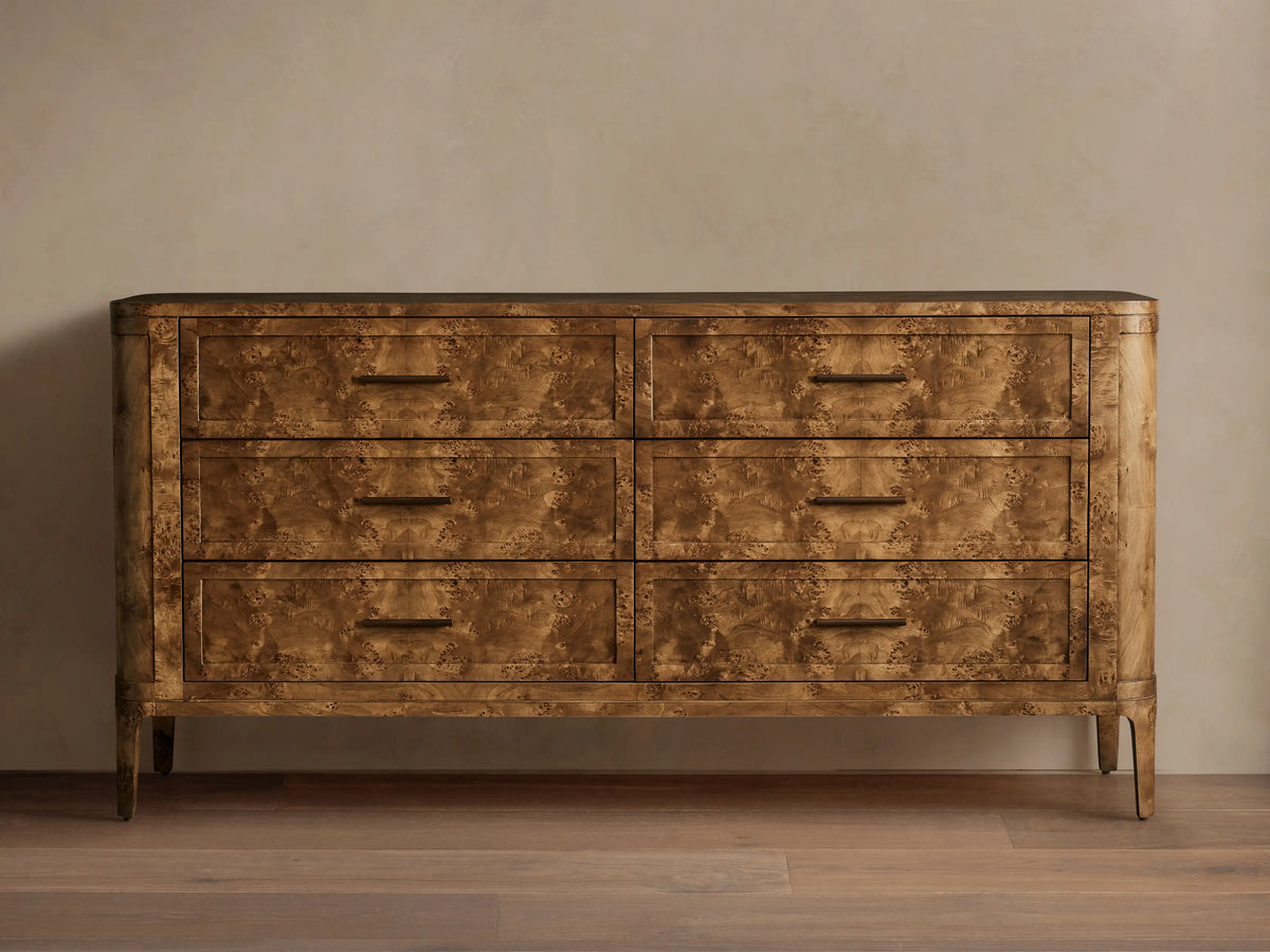 Front view of the golden-brown Mappa burl wood Mogadore Six-Drawer Dresser with six drawers and antiqued brass-finished hardware.