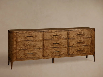 Front view of the Mogadore Nine-Drawer Dresser, made from brown mappa burl wood, featuring nine drawers with antiqued brass pulls.