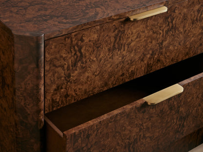 Wooden dresser with six drawers, featuring a rich brown textured finish and gold handles. Placed against a taupe background.