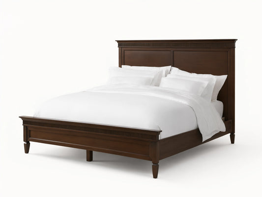 Ottavia Bed made of Tanganika wood with a dark brown finish, featuring a high headboard and white bedding on a wooden floor.