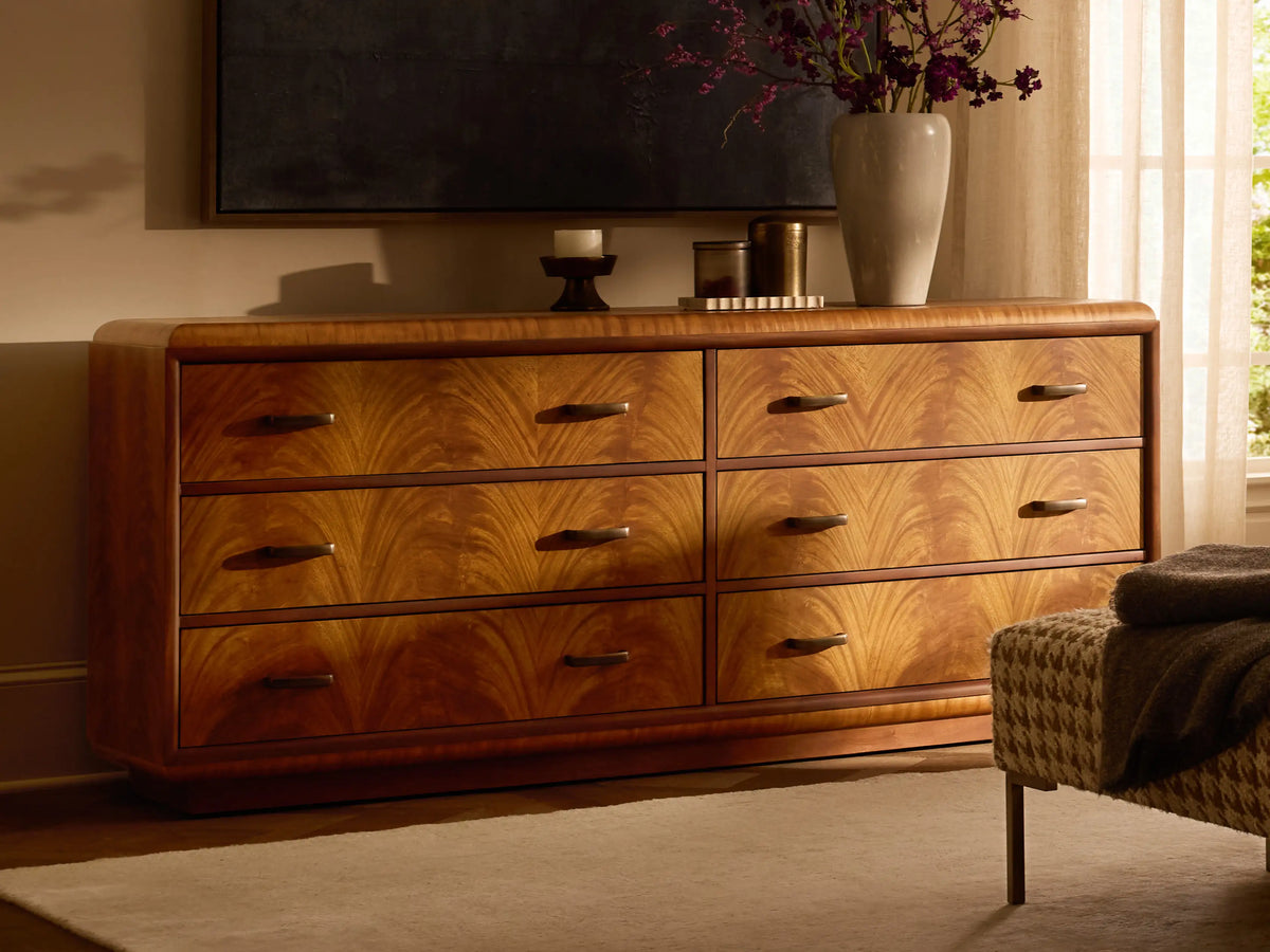 Front view of the brown Palma Six-Drawer Dresser, showcasing distinctive cerajeira veneer graining and aged bronze hardware.