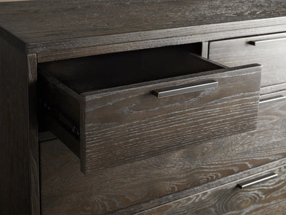 Palmer Six-Drawer Dresser in dark wood finish with sleek black iron handles. Tall rectangular design on slim black metal legs.