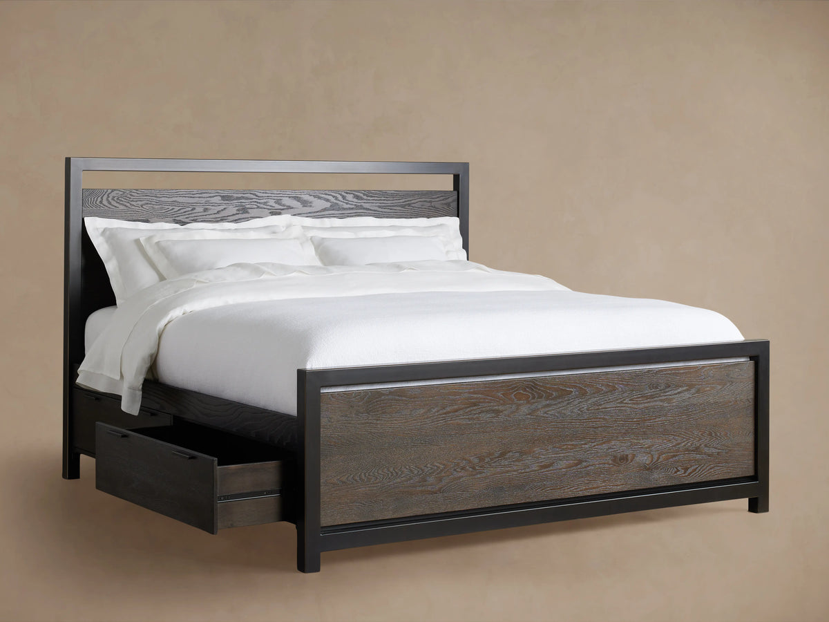 Palmer Storage Bed in dark wood finish with two side drawers, white bedding, and pillows; set against a beige background.