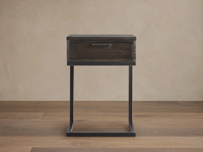 Palmer Storage Nightstand with a dark wood finish and a single drawer. Features a sleek, black iron frame in a Parsons style.