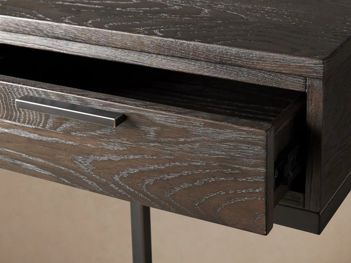 Palmer Storage Nightstand with dark wood finish, single drawer, and sleek Parsons-style iron frame on wooden floor.