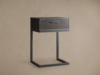 Palmer Storage Nightstand featuring a partially open drawer with visible wood grain pattern in a dark finish, metal handle, and iron frame.