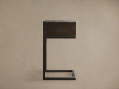 Palmer Storage Nightstand with a dark wood finish, rectangular shape, and black metal frame in a side profile view against a beige background.