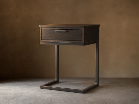 Palmer Storage Nightstand with a dark wood finish and a single drawer. Features a sleek, black iron frame in a Parsons style.