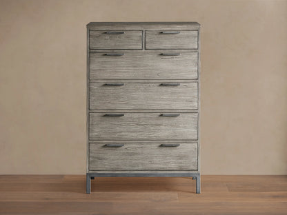 Palmer Six-Drawer Dresser in Stone on Ash finish, featuring six spacious drawers and a sleek gray metal frame, against a beige background.