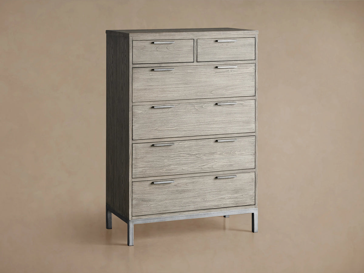 Palmer Six-Drawer Dresser in Stone on Ash finish, featuring six spacious drawers and a sleek gray metal frame, against a beige background.