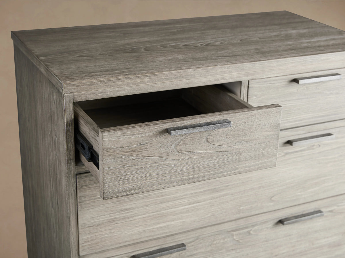 Palmer Six-Drawer Dresser in light wood finish with six drawers, slim metal handles, and iron legs on a neutral background.