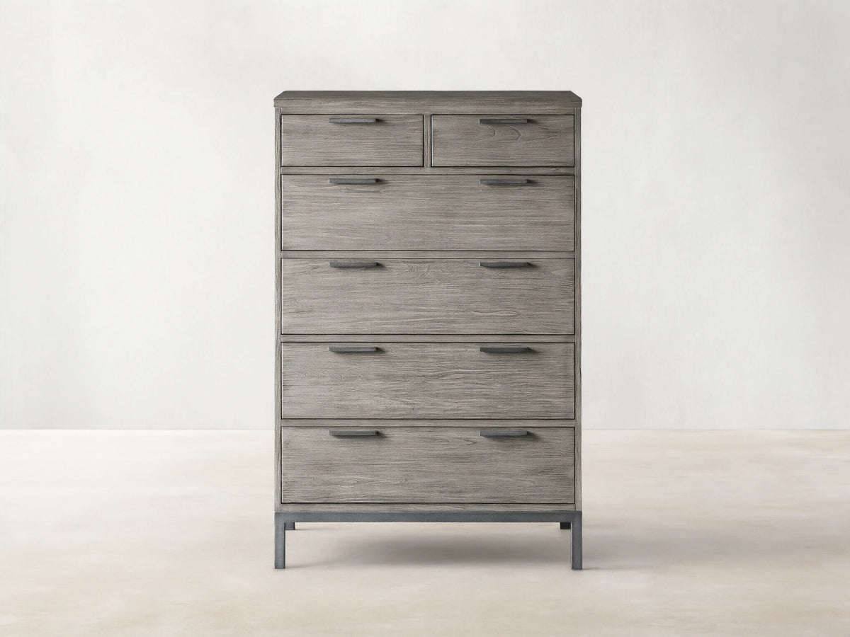Palmer Six-Drawer Dresser in Stone on Ash finish, featuring six spacious drawers and a sleek gray metal frame, against a beige background.