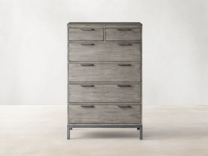 Palmer Six-Drawer Dresser in Stone on Ash finish, featuring six spacious drawers and a sleek gray metal frame, against a beige background.