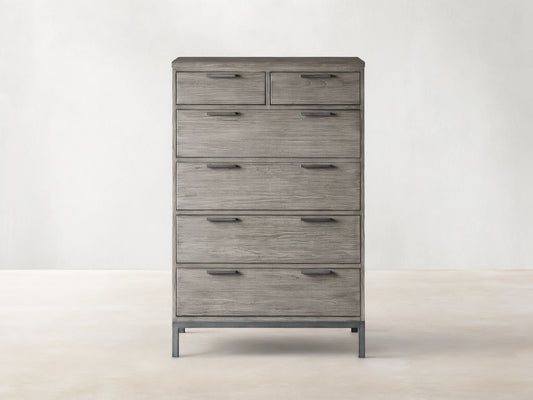 Palmer Six-Drawer Dresser in Stone on Ash finish, featuring six spacious drawers and a sleek gray metal frame, against a beige background.