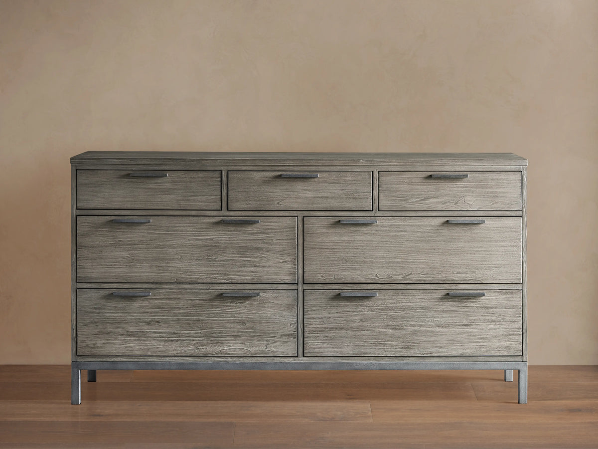 Palmer Seven-Drawer Dresser in gray wood finish, featuring a Parsons-style iron frame. Three small drawers on top, four large below.