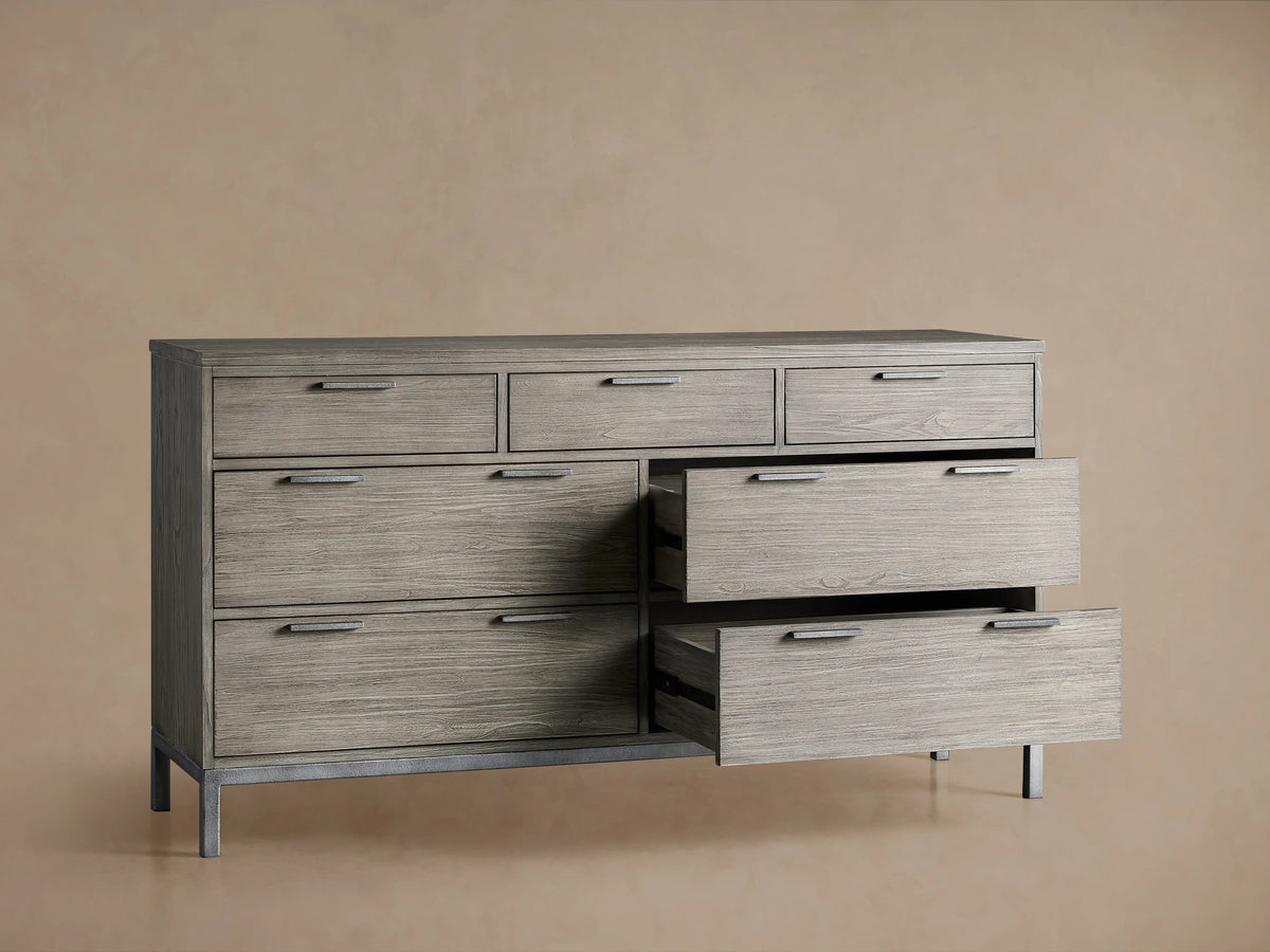 Palmer Seven-Drawer Dresser in a gray finish with sleek metal handles, featuring open drawers on a sturdy iron frame.