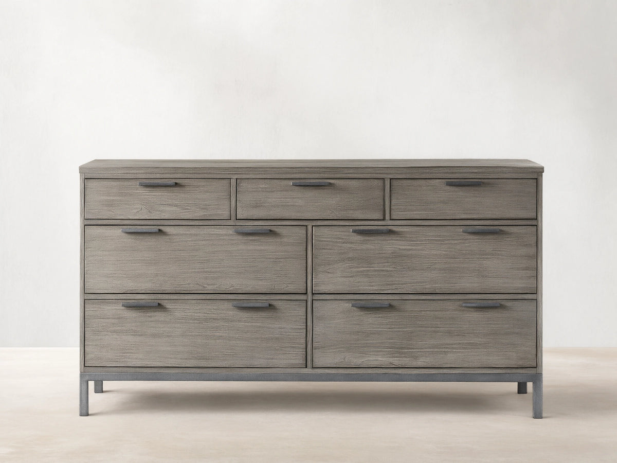 Palmer Seven-Drawer Dresser in gray wood finish, featuring a Parsons-style iron frame. Three small drawers on top, four large below.