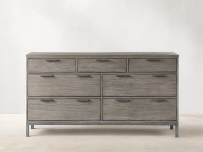 Palmer Seven-Drawer Dresser in gray wood finish, featuring a Parsons-style iron frame. Three small drawers on top, four large below.