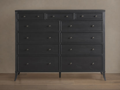 Pearson Eleven-Drawer Dresser in dark wood with hand-carved, curved molding. Features small, round handles and stands on four tapered legs.
