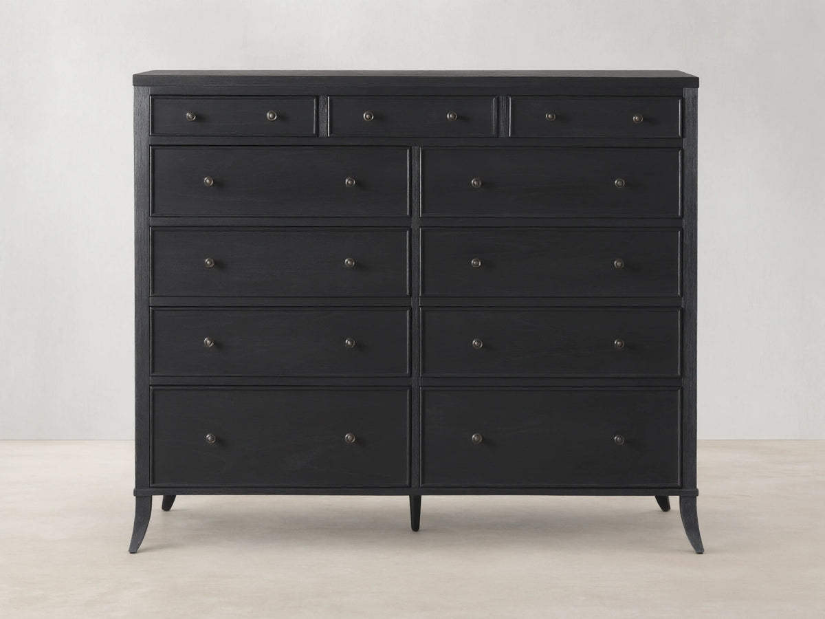 Pearson Eleven-Drawer Dresser in dark wood with hand-carved, curved molding. Features small, round handles and stands on four tapered legs.