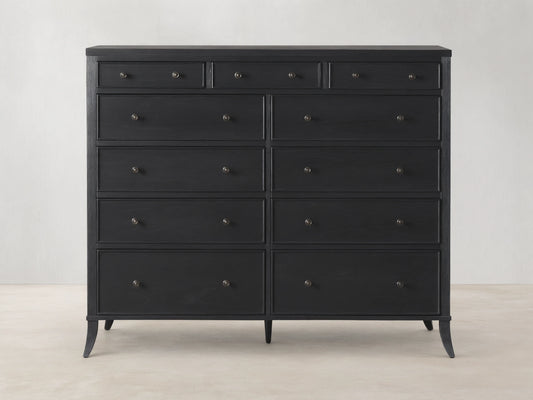 Pearson Eleven-Drawer Dresser in dark wood with hand-carved, curved molding. Features small, round handles and stands on four tapered legs.