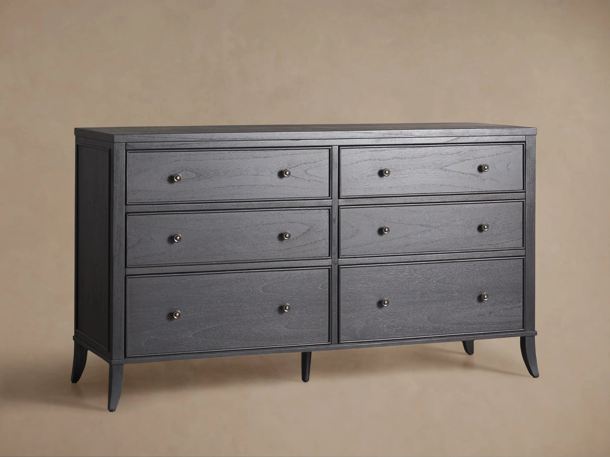 Pearson Wide Six-Drawer Dresser in dark brushed wood with visible grain, featuring 6 drawers with round metal knobs, on a wood floor.