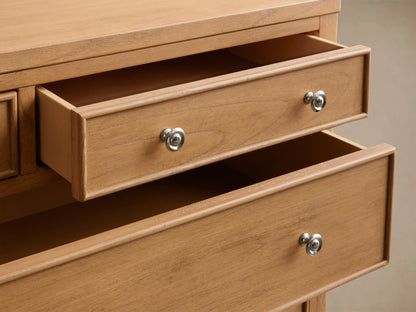 Close-up of two partially open drawers of the light brown Pearson Eleven-Drawer Dresser, with curved molding and silver-toned pulls.