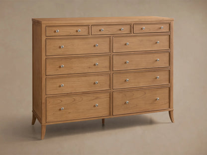 Front view of the Natural wood Pearson Eleven-Drawer Dresser, featuring eleven drawers with silver round knobs and tapered legs.