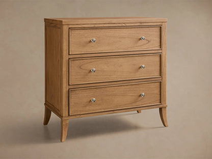 Front view of the light brown Pearson Three-Drawer Chest, featuring three drawers with silver knobs and tapered legs.