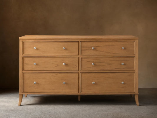 Front view of the light brown wooden Pearson Wide Six-Drawer Dresser with six drawers and silver knobs.