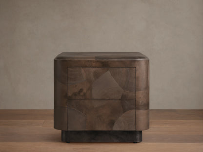 Polanco Nightstand with oyster-cut wood pattern, featuring earthy tones and cracks. Steel base, smooth drawer front, push-to-open design.