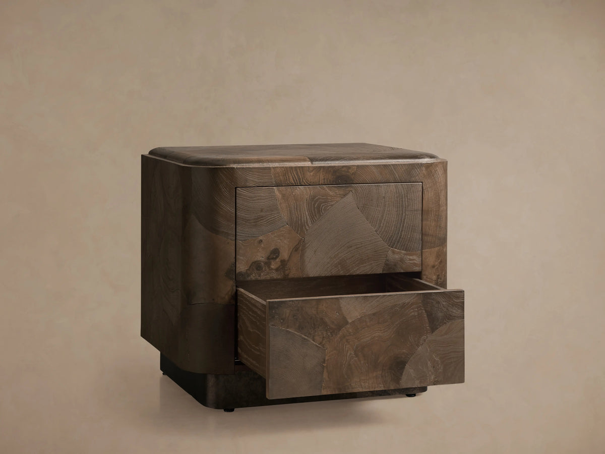 Polanco Nightstand with a drawer partially open, showcasing its handcrafted oyster-cut salvaged ash with unique textures and a rich patina.