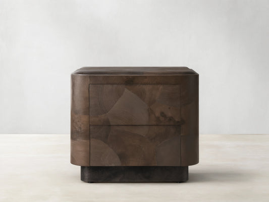 Polanco Nightstand with oyster-cut wood pattern, featuring earthy tones and cracks. Steel base, smooth drawer front, push-to-open design.