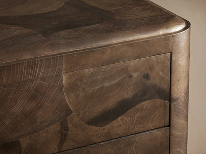 Close-up of the Polanco Five-Drawer Dresser corner, showcasing its oyster-cut wood with natural graining and unique patterns.