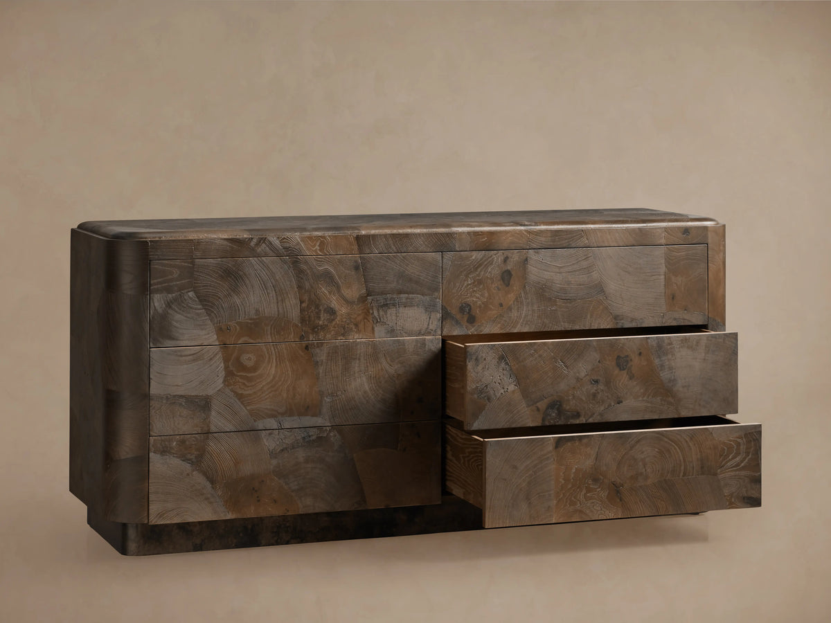 Polanco Six-Drawer Dresser made from ash wood, showing natural textures and cracks. Two drawers are partially open, revealing interior.