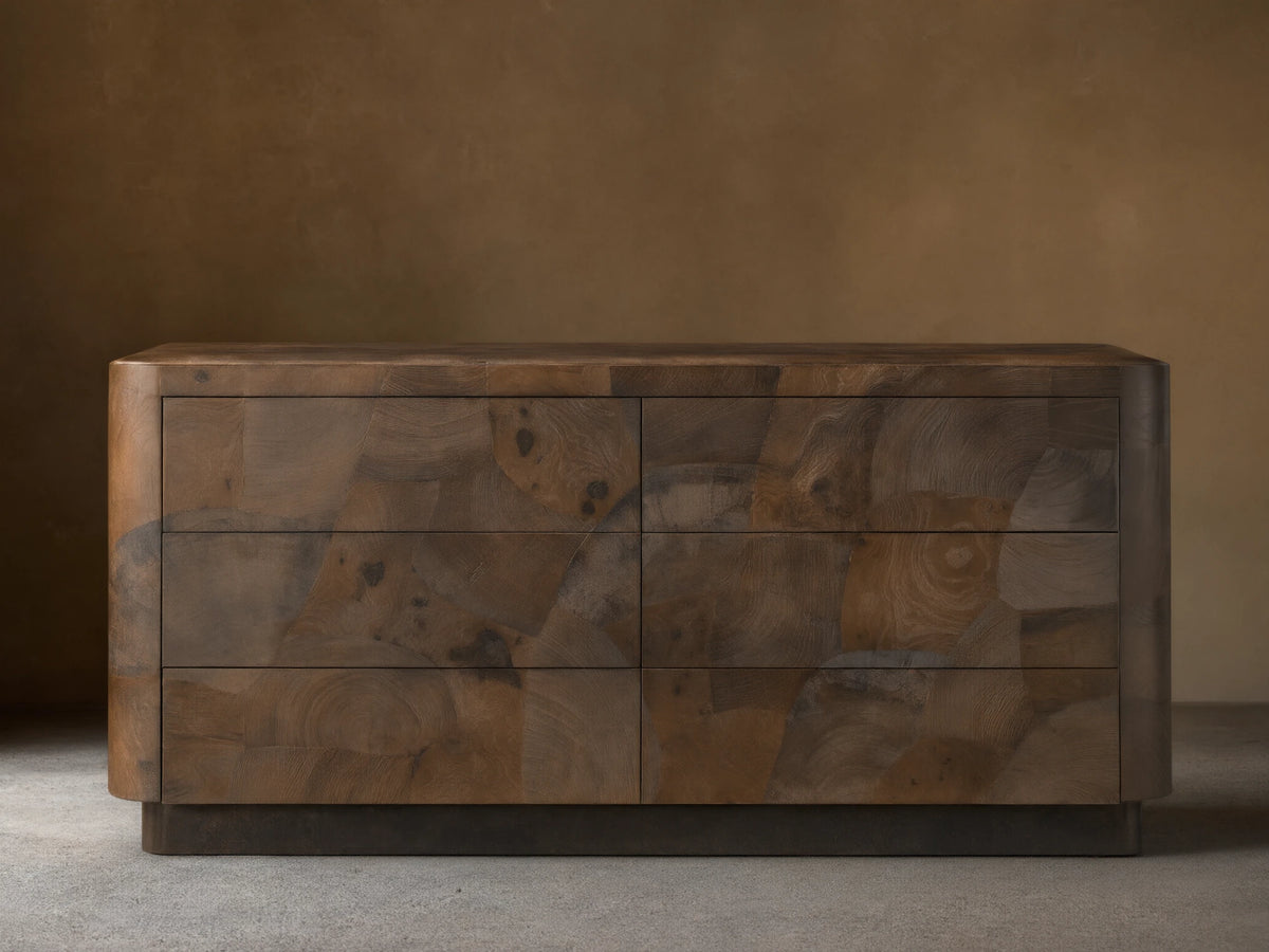 Polanco Six-Drawer Dresser made from salvaged ash wood with visible graining, cracks, and patina. Features a smooth, rectangular design.