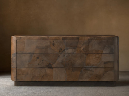 Polanco Six-Drawer Dresser made from salvaged ash wood with visible graining, cracks, and patina. Features a smooth, rectangular design.