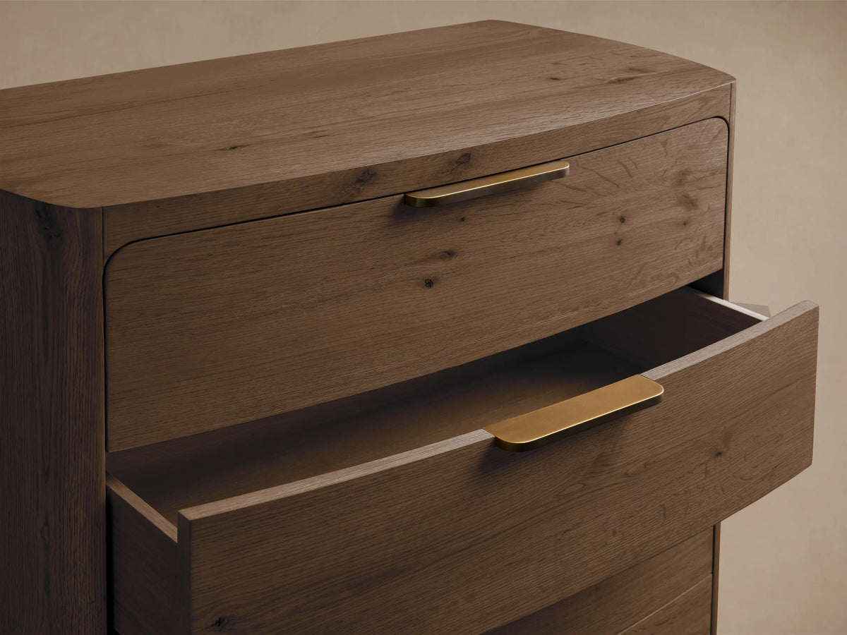 Front view of the Redding Five-Drawer Dresser, crafted from reclaimed oak with five drawers and antique brass handles.