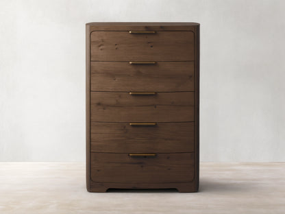 Front view of the dark brown Redding Five-Drawer Dresser, with rounded corners and antique brass handles.