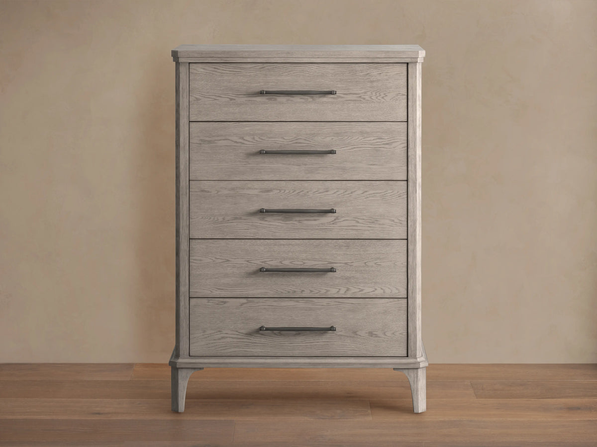 St. Martin Five-Drawer Dresser in light oak finish, features five aligned drawers with pewter handles, on a wooden floor.