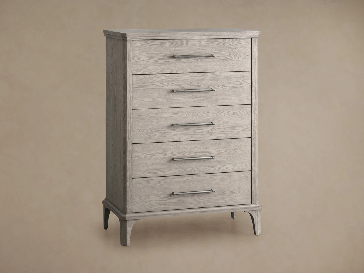 St. Martin Five-Drawer Dresser in light oak finish, features five aligned drawers with pewter handles, on a wooden floor.
