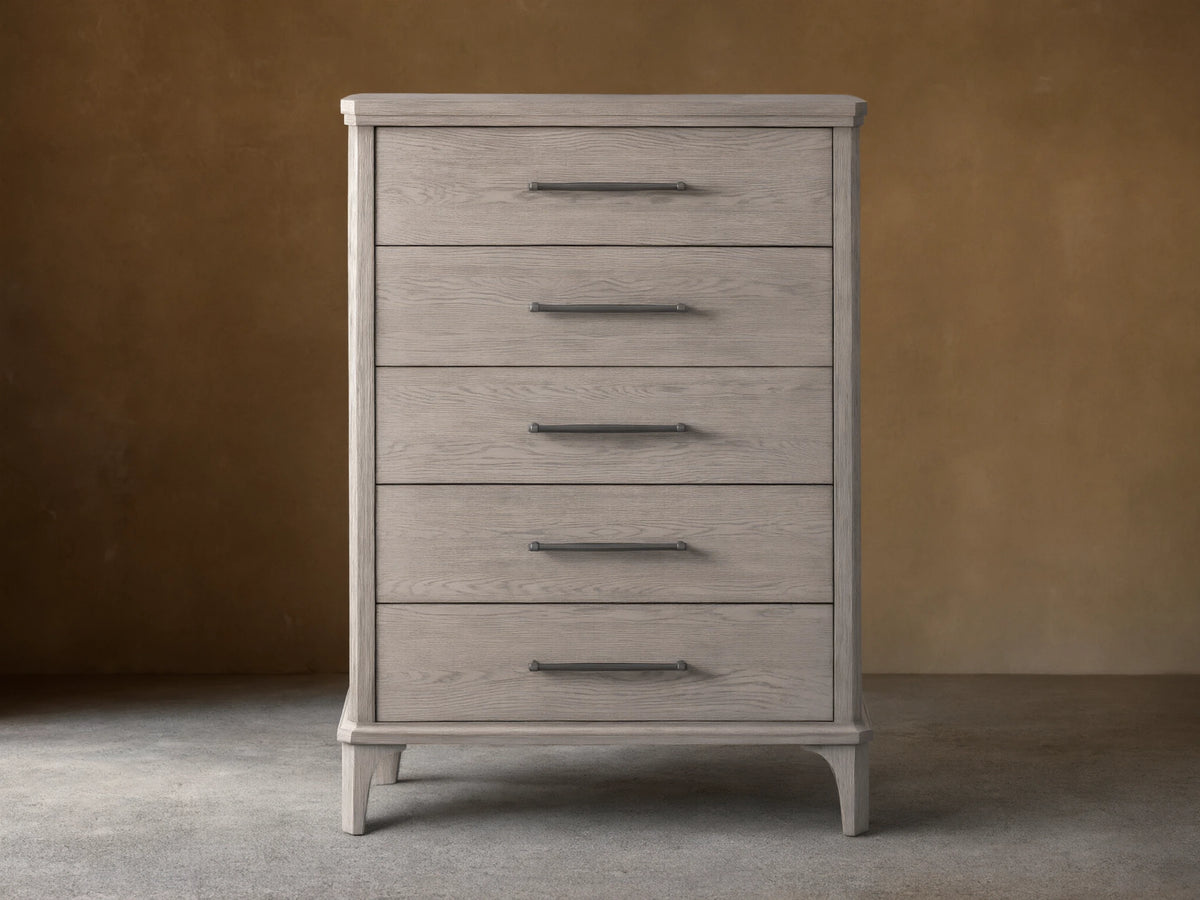 St. Martin Five-Drawer Dresser in light oak finish, features five aligned drawers with pewter handles, on a wooden floor.