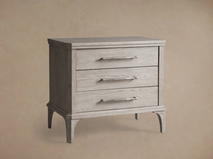 St. Martin Closed Nightstand in Haze finish; oak wood with pewter-finished hardware and soft-close drawers, sitting on wooden floor.