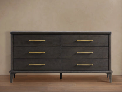 St. Martin Six-Drawer Dresser in smoke-finished oak, six drawers with brass-finished bar pulls, front view against a light wall.