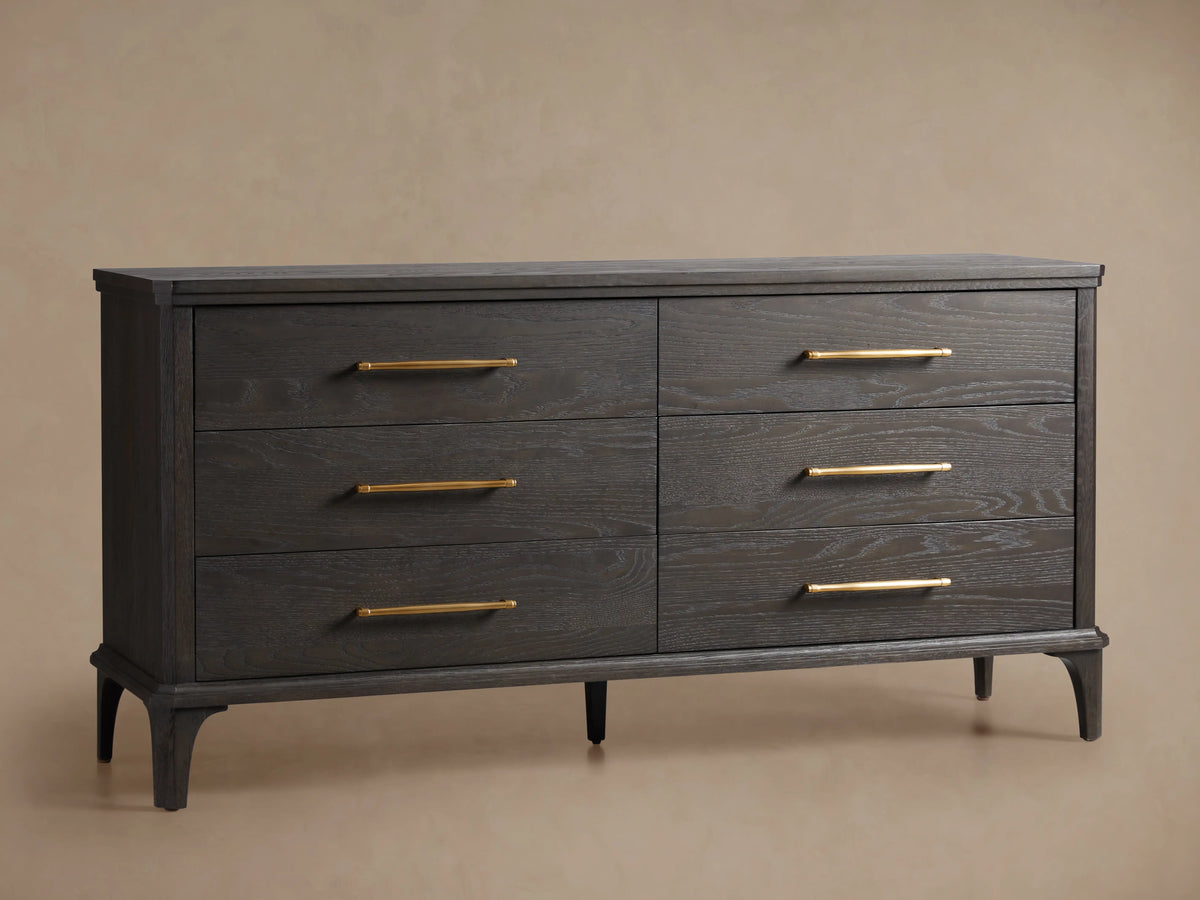 St. Martin Six-Drawer Dresser in smoke-finished oak, six drawers with brass-finished bar pulls, front view against a light wall.
